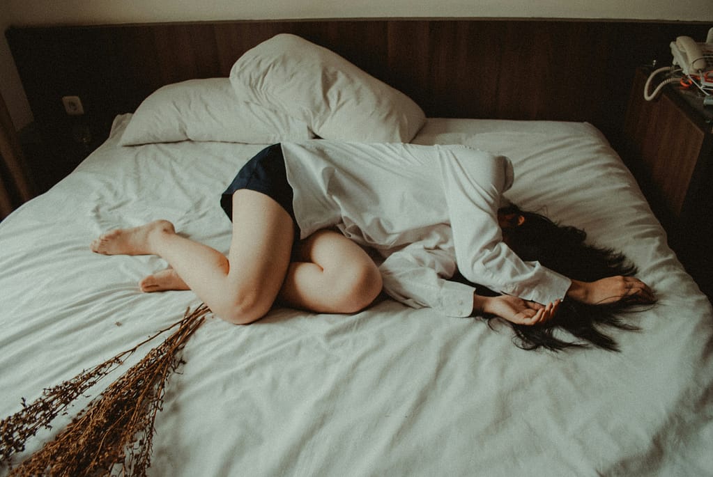 yuris-alhumaydy-mSXMHkgRs8s-unsplash woman lying in bed