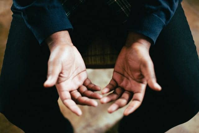 Hands opening lost in faith