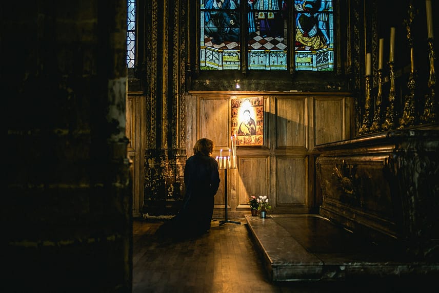 Woman praying to Blessed Virgin Mary